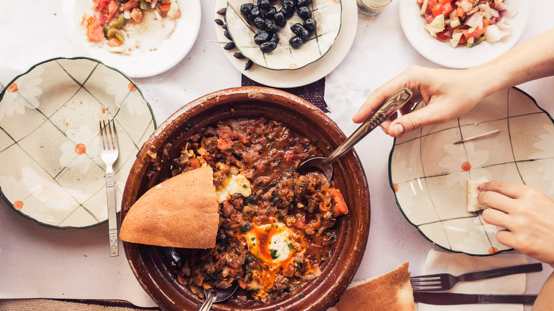 A Moroccan tajine with bread and eggs served in Erfoud